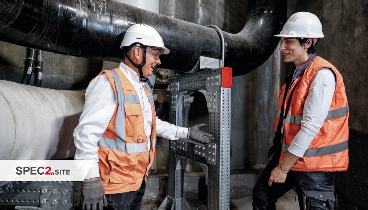 a Hilti engineer and a customer inspect a modular support system for piping