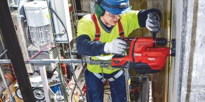 TE 6-A22 cordless rotary hammer being used with an integrated dust removal system