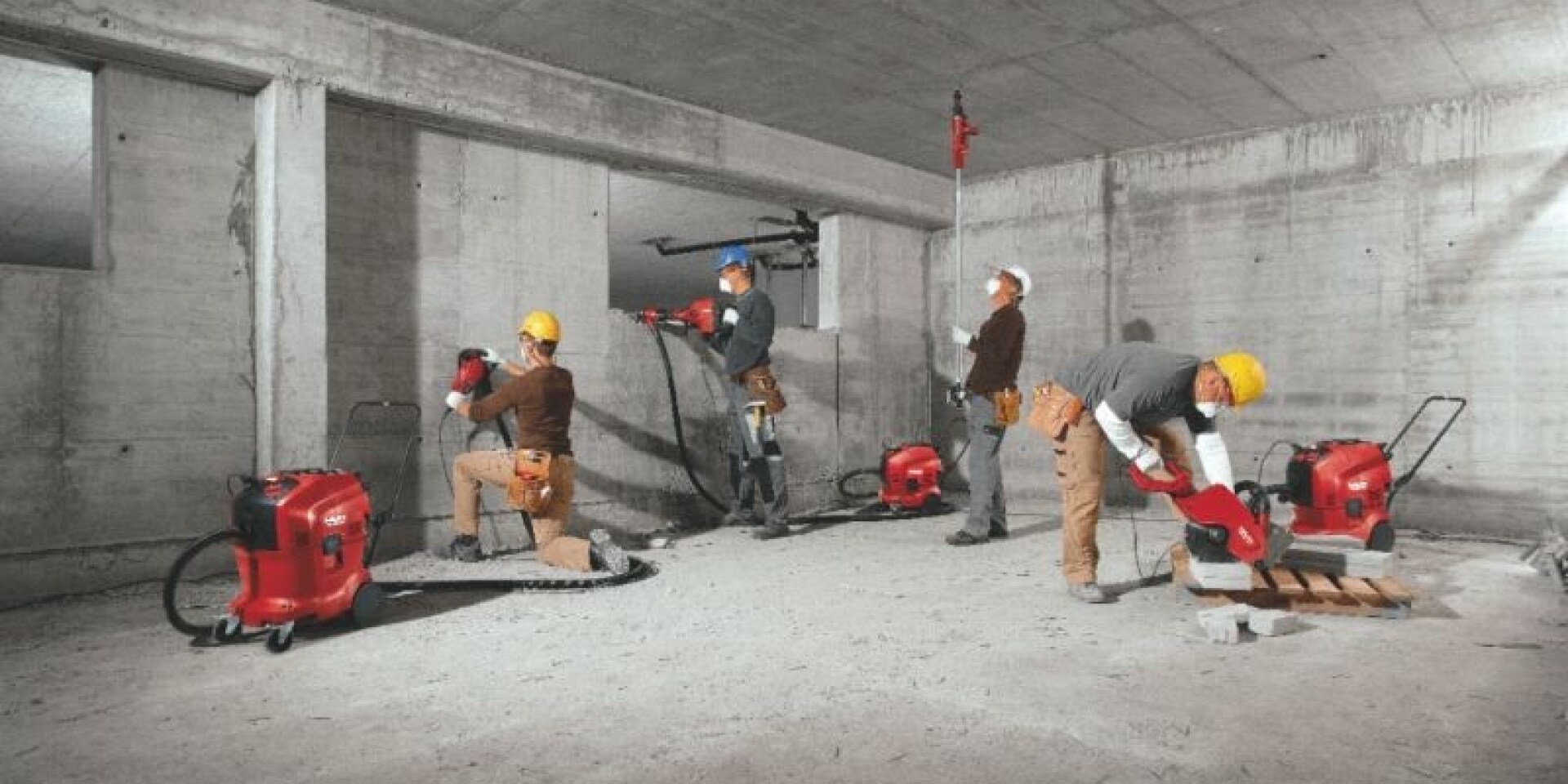 Image of all the full portfolio of Hilti vacuum cleaners being used on the construction site 