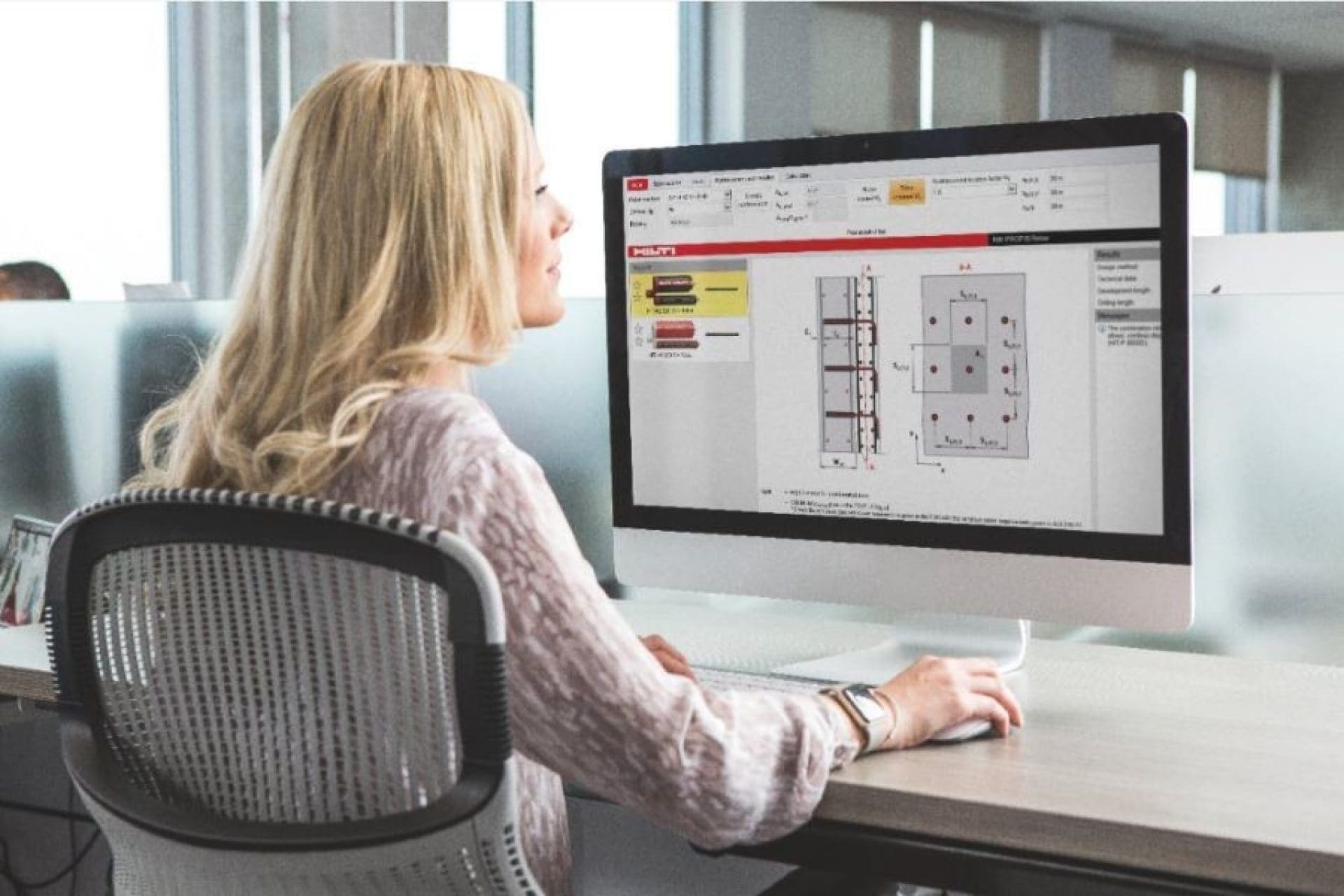 Female employee designing on Profis software.